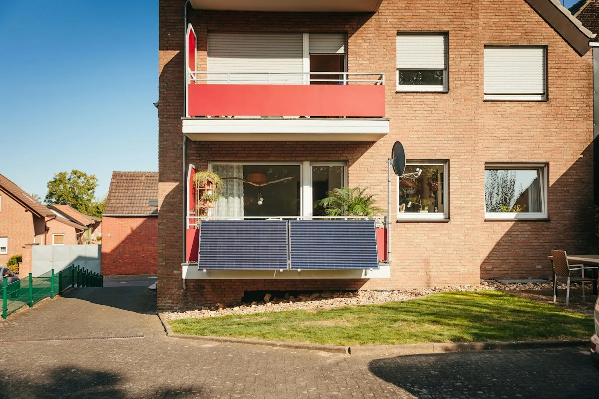 A plug-in solar panel fixed to a balcony railing