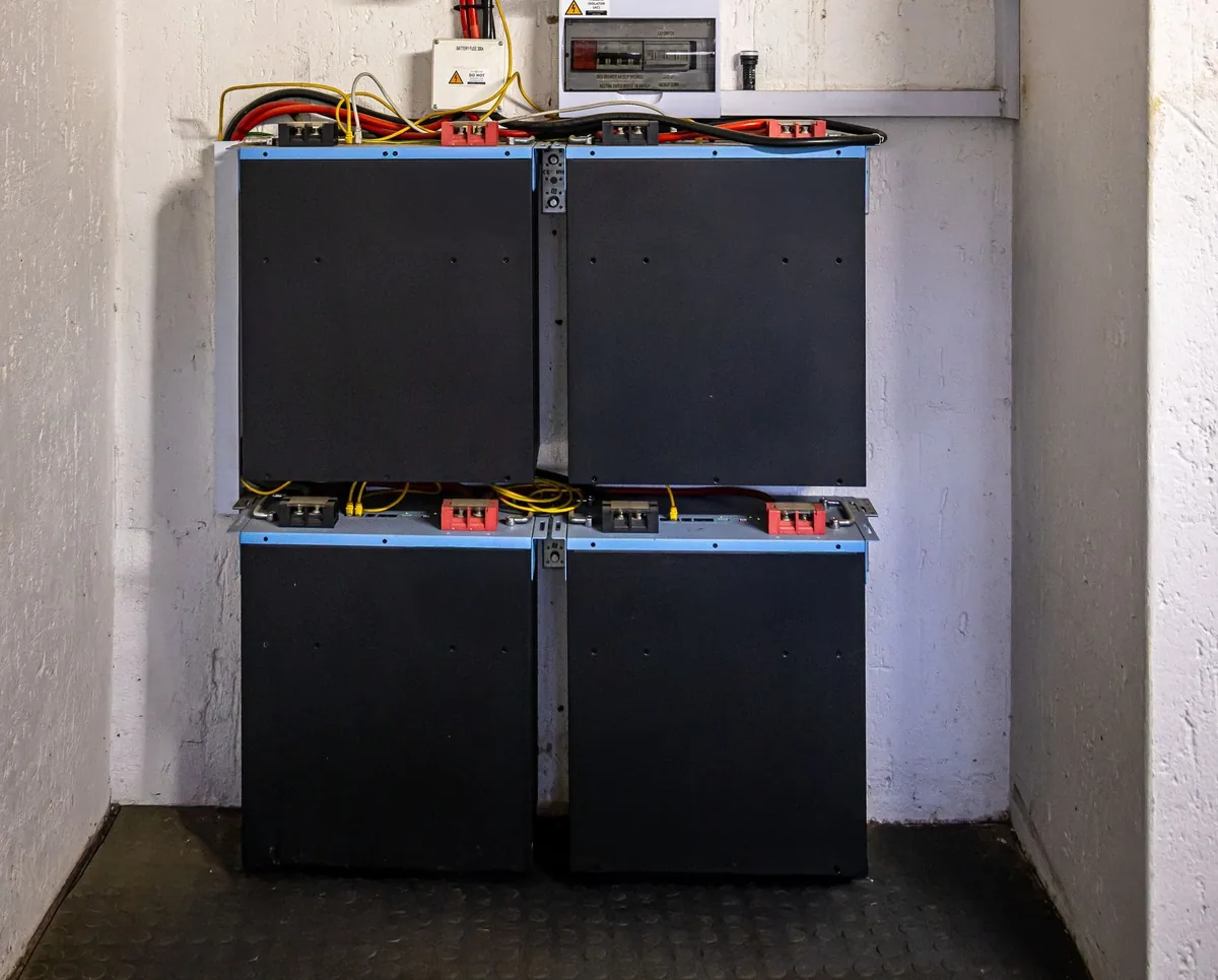 A home battery made of four stacked modules fixed to a wall